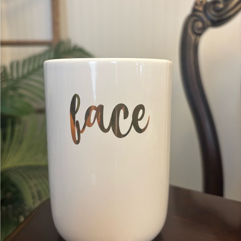 White Mug with Gold 'Face' Text